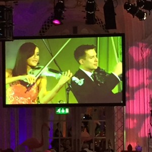 FUSE electric violinists peform